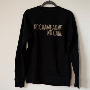 Elegant Black Crewneck Sweater with Gold Text